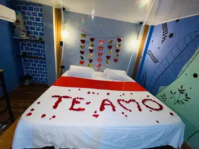 a bedroom with a bed with a sign that says inn at Habitación tipo loft turistico in Mariquita