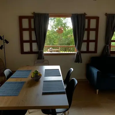 a dining room table with a bowl of fruit on it at Casa Calandria - Vive Jardin in Jardin