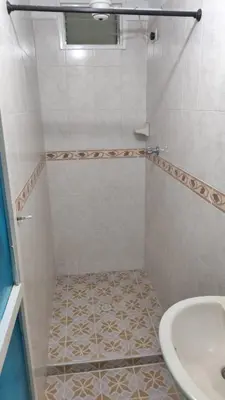 a bathroom with a shower and a sink at Hotel Los Colores GUATAPE in Guatapé