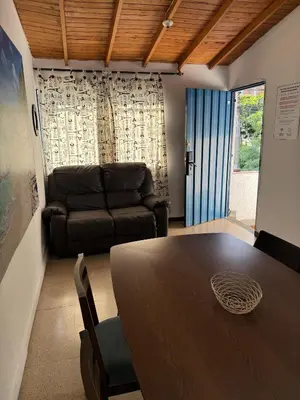 a living room with a table and a couch at Apartamento Sosiego in Medellín