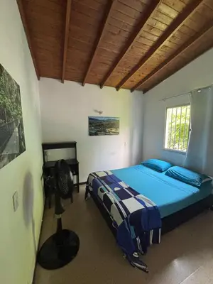 a bedroom with a bed and a desk in it at Apartamento Sosiego in Medellín