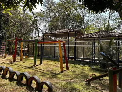 a playground in a park with a building at Paradise San Jeronimo Parcelacion 6BR AC Pool in San Jerónimo