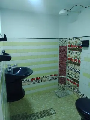 a bathroom with a sink and a shower at Casa Prado Centro in Medellín