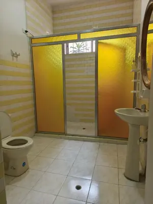 a bathroom with a shower and a toilet and a sink at Casa Prado Centro in Medellín