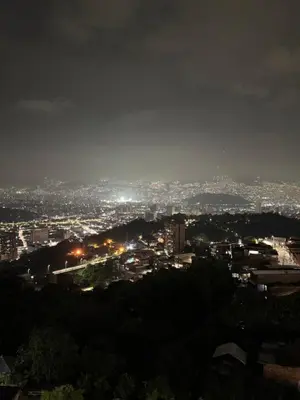 a view of a city at night at Apartamento alto de palmas in Medellín
