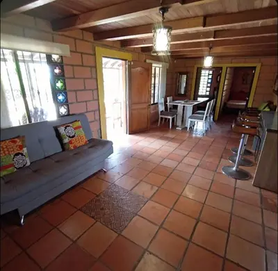 a living room with a couch and a table at Finca Oriente Antioqueño Guarne Rionegro in Guarne
