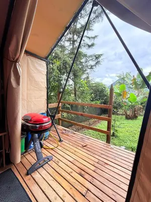 a porch of a tent with a swing at Casa incluyendo Glamping! 13 personas, Familias con niños in Jardin