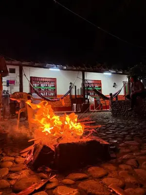 a fire pit in a yard at night at Casa incluyendo Glamping! 13 personas, Familias con niños in Jardin