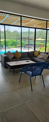 two beds in a room with a view of a pool at Luxury Estate with Private Pool & Jacuzzi in Sopetran
