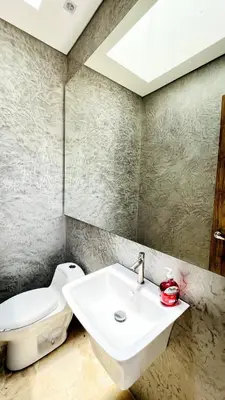 a bathroom with a sink and a toilet at Luxury Estate with Private Pool & Jacuzzi in Sopetran
