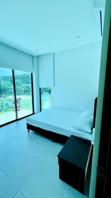 a bedroom with a bed and a large window at Luxury Estate with Private Pool & Jacuzzi in Sopetran