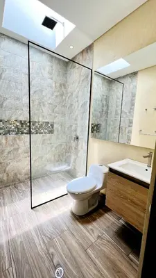 a bathroom with a toilet and a shower and a sink at Luxury Estate with Private Pool & Jacuzzi in Sopetran
