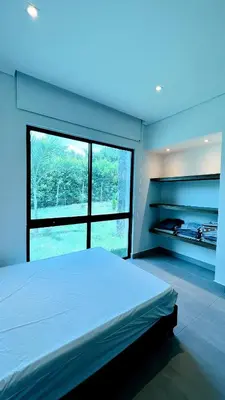 a bedroom with a large bed and a large window at Luxury Estate with Private Pool & Jacuzzi in Sopetran