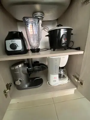 a shelf with a blender and other kitchen items on it at Acogedor y cómodo apartamento in Sabaneta