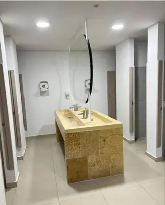 a bathroom with a sink and a mirror at Acogedor y cómodo apartamento in Sabaneta