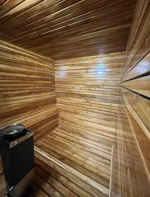 a wooden sauna with a trash can in it at Acogedor y cómodo apartamento in Sabaneta