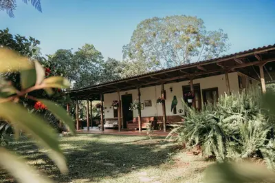 a building with plants in front of it at Tinamú Birding and Nature Lodge in Manizales