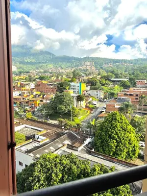 a view of a city from a window at Alojamiento Central en Medellín en Zona Turística BA in Medellín
