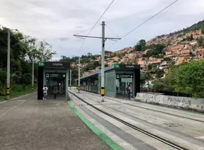 a train station with people waiting on the tracks at Alojamiento Central en Medellín en Zona Turística BA in Medellín