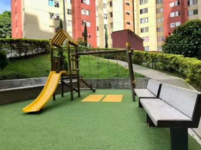 a park with a playground with a slide and a bench at Alojamiento Central en Medellín en Zona Turística BA in Medellín