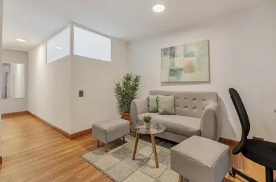 a living room with a couch and a table at Apartamento con aire laureles201 in Medellín