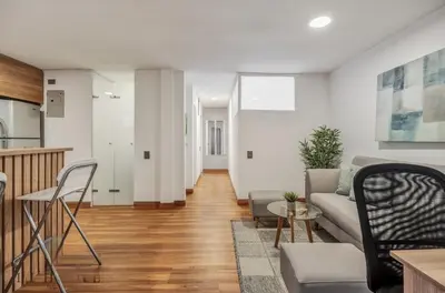 a living room with a couch and a table at Apartamento con aire laureles201 in Medellín