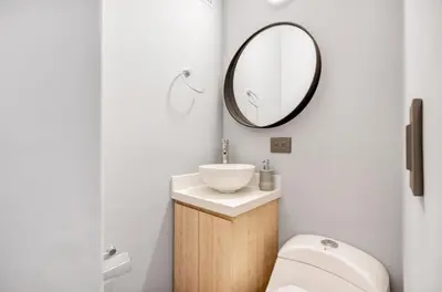 a bathroom with a sink and a mirror at Apartamento con aire laureles201 in Medellín