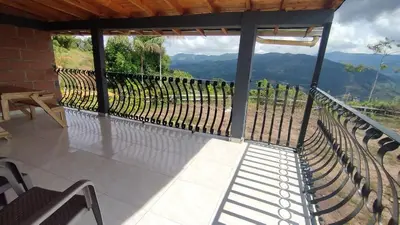 a balcony with a view of a mountain at Cabaña Mirador Santa Ana in San Rafael