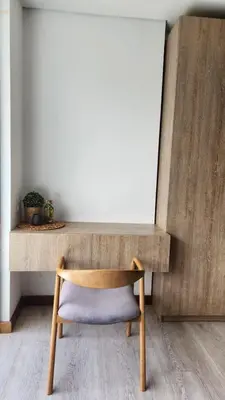a chair sitting in front of a wooden desk at New Countryside Apartaloft 213 in El Retiro