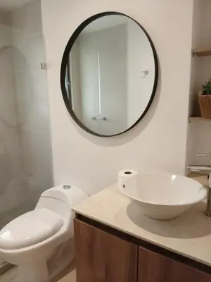a bathroom with a white toilet and a mirror at New Countryside Apartaloft 213 in El Retiro