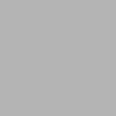 a bedroom with a bed and two blue chairs at Nomadic Suites in Medellín