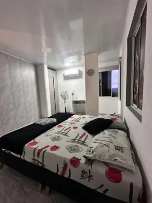 a bedroom with a large bed in a room at Apartamento días - weeks with kitchen in Santa Fe de Antioquia