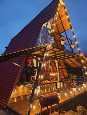 a glass house with lights on the roof at Glamping arcoiris r in Ciudad Bolívar