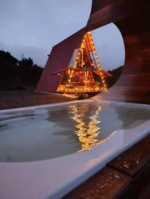 a bath tub with a building in the background at Glamping arcoiris r in Ciudad Bolívar