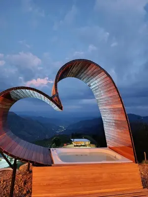 a sculpture of an arch on top of a building at Glamping arcoiris r in Ciudad Bolívar