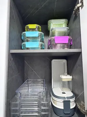 a closet with several plastic containers and a toilet at Apartamento en Belen cerca a Laureles, wifi, Balcon y Patio in Medellín