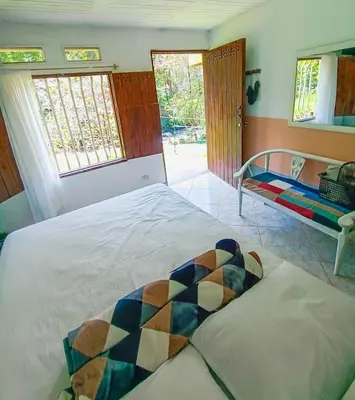 a bedroom with a bed and a window at Apartamento en concepción entorno natural in Concepción