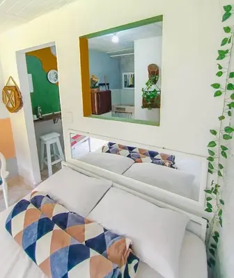 two beds in a room with a mirror at Apartamento en concepción entorno natural in Concepción