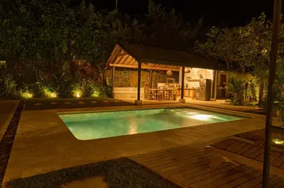 a swimming pool at night with a gazebo at Villa Talataa in Tarso