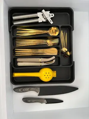 a drawer filled with gold utensils and a knife at 15minPOBLADO-LUXURY-Sabaneta in Sabaneta