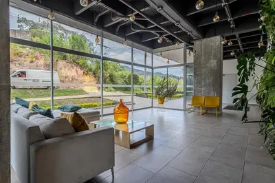 a living room with a couch and a table at 15minPOBLADO-LUXURY-Sabaneta in Sabaneta