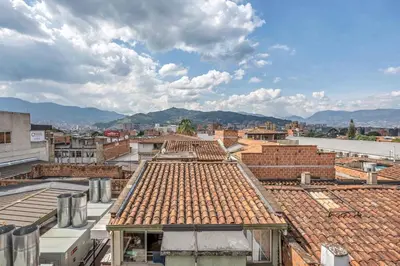 a view of roofs of buildings in a city at Luxury Penthouse Con Aire acondicionado in Envigado