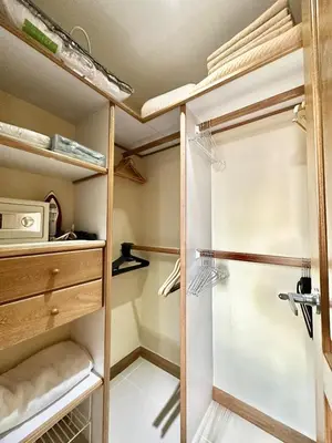 a walk in closet with a glass door at Beautiful Laureles apartment in Medellín