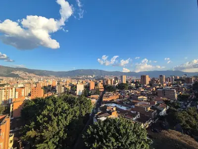 an aerial view of a city with buildings and trees at Laureles 11th Floor, Jacuzzi and AC in Medellín