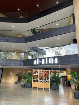 a building with a sign that reads ohma at Suite Rioverde Hotel Rionegro in Rionegro