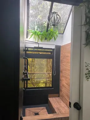 a room with a window in a house at Cabaña Lambrusco - La Cava Lodge in Medellín