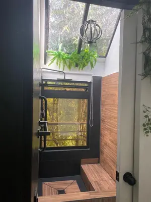 a room with a window in a house at Cabaña Lambrusco - La Cava Lodge in Medellín