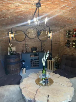 a room with a table with wine glasses on it at Cabaña Lambrusco - La Cava Lodge in Medellín