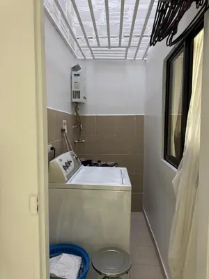 a bathroom with a sink and a toilet at Apartamento cálido in Medellín