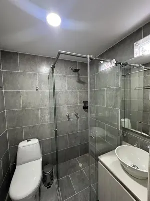 a bathroom with a shower and a toilet and a sink at Comfortable apartment in Sabaneta in Sabaneta